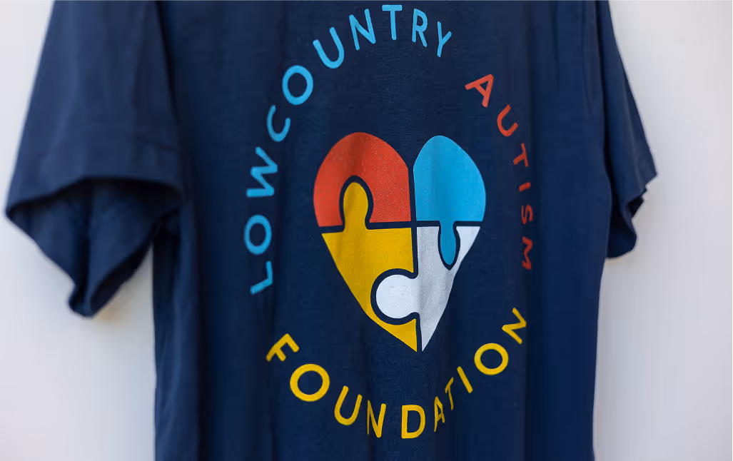 Blue t-shirt with Low Country Autism Foundation printed on the back