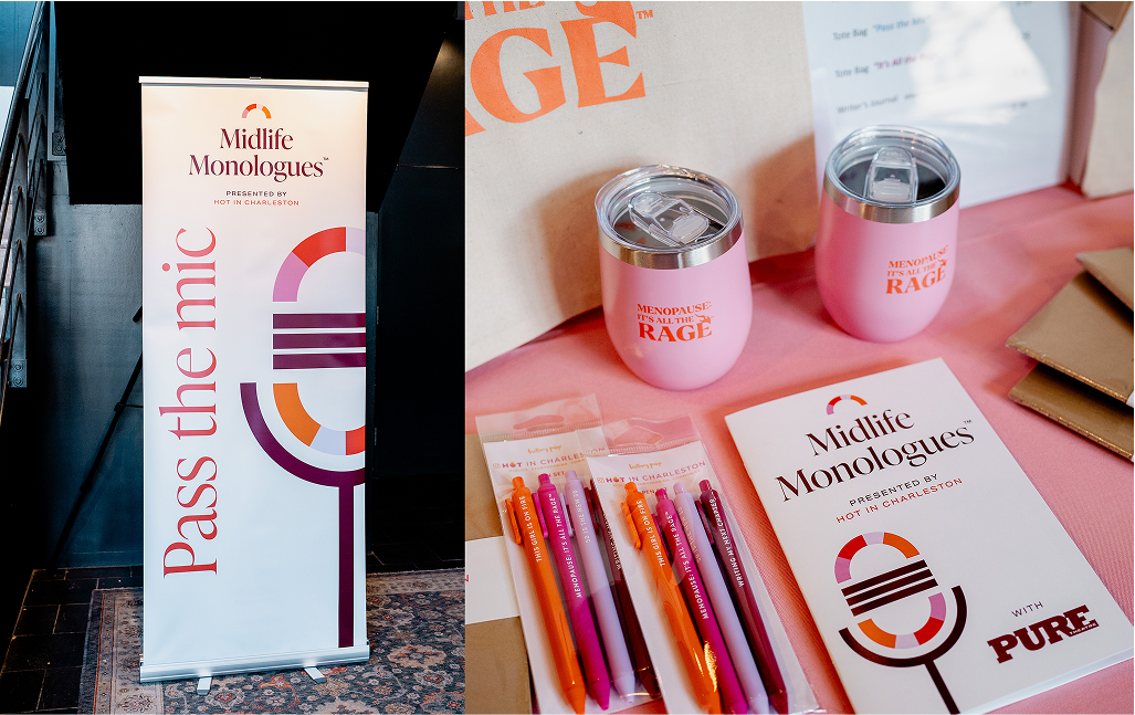 Branded merchandise and print materials for Midlife Monologues event, including a banner, booklets, pens, and insulated tumblers on a pink table