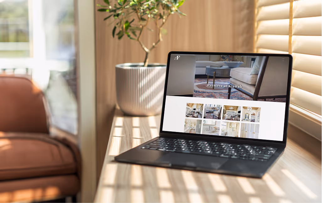Laptop displaying the Alex Fleuren Interiors website