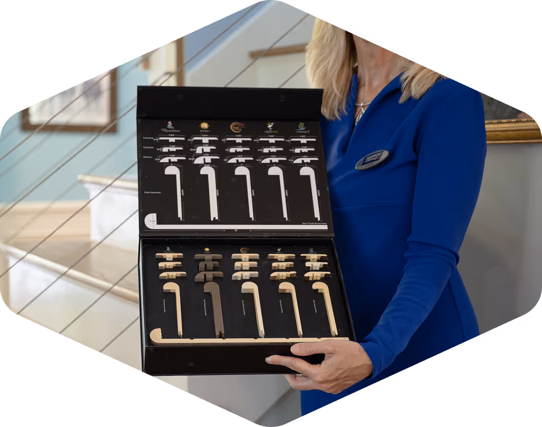 Flooring services employee holding an open case of various flooring material samples