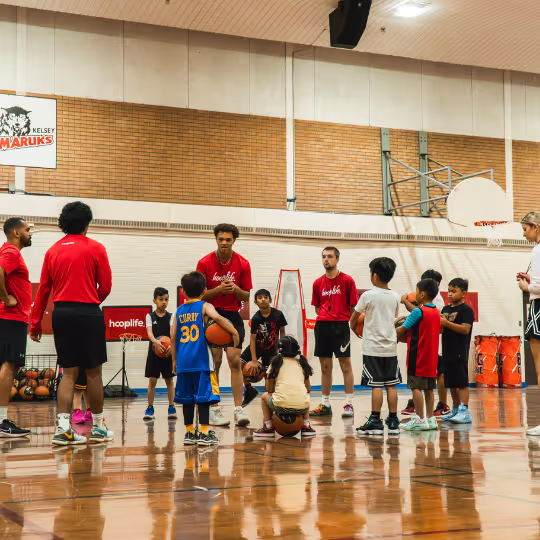 Coach talking to athletes
