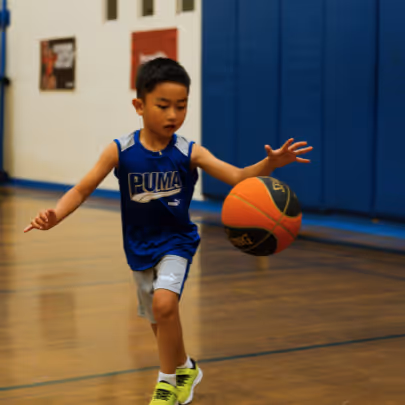 Kid dribbling basketball