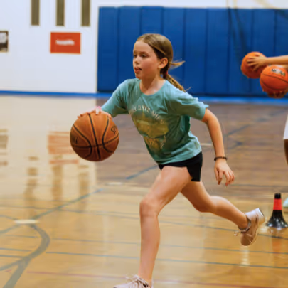 Girl running with a basketball