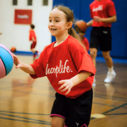 Girl running with a basketball