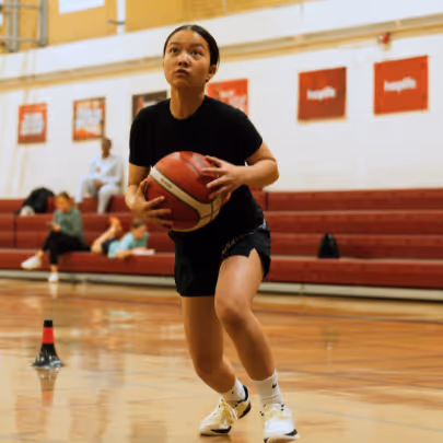 Girl running with a baketball