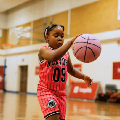 Girl dribbling a basketball