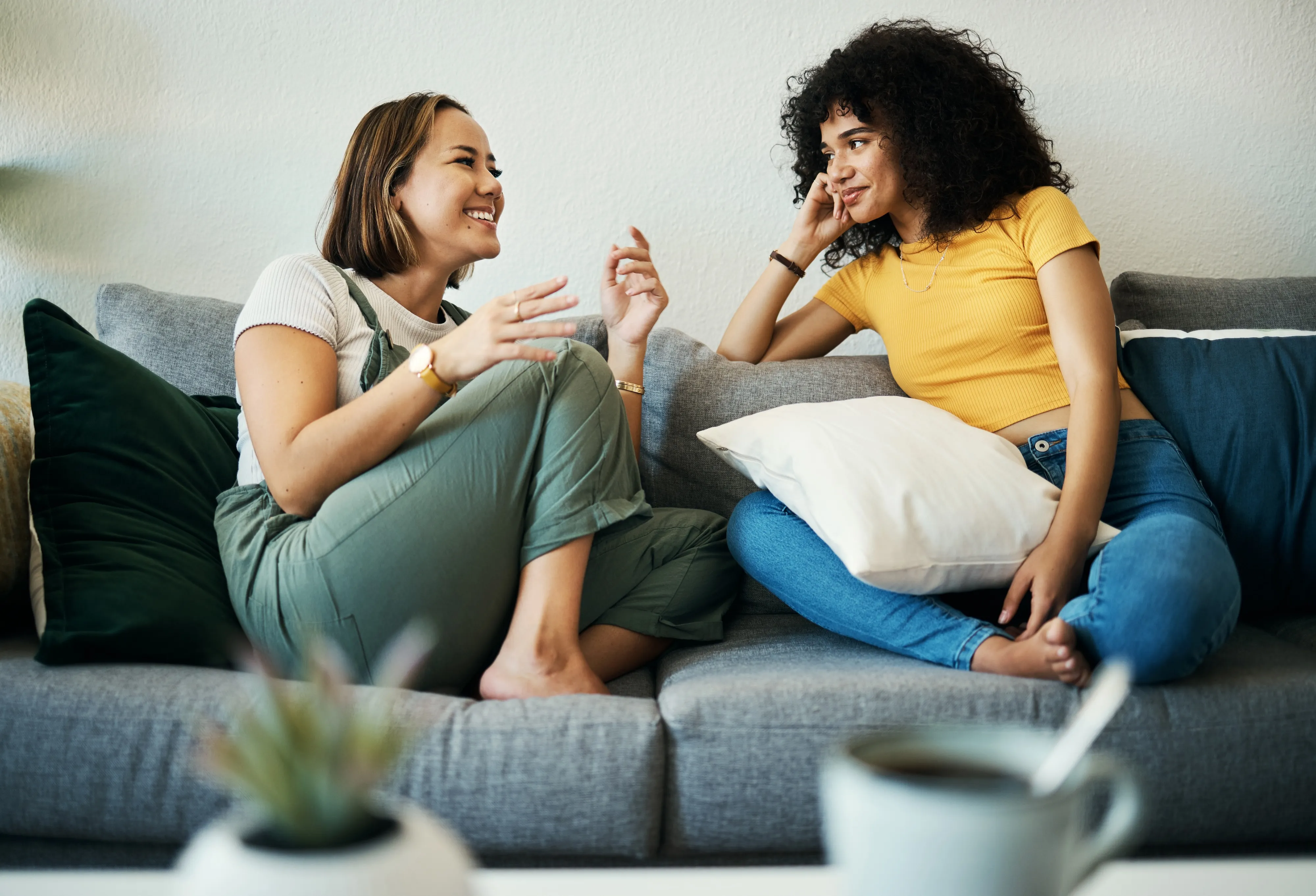 Students sitting on couch in new apartment in Mansfield