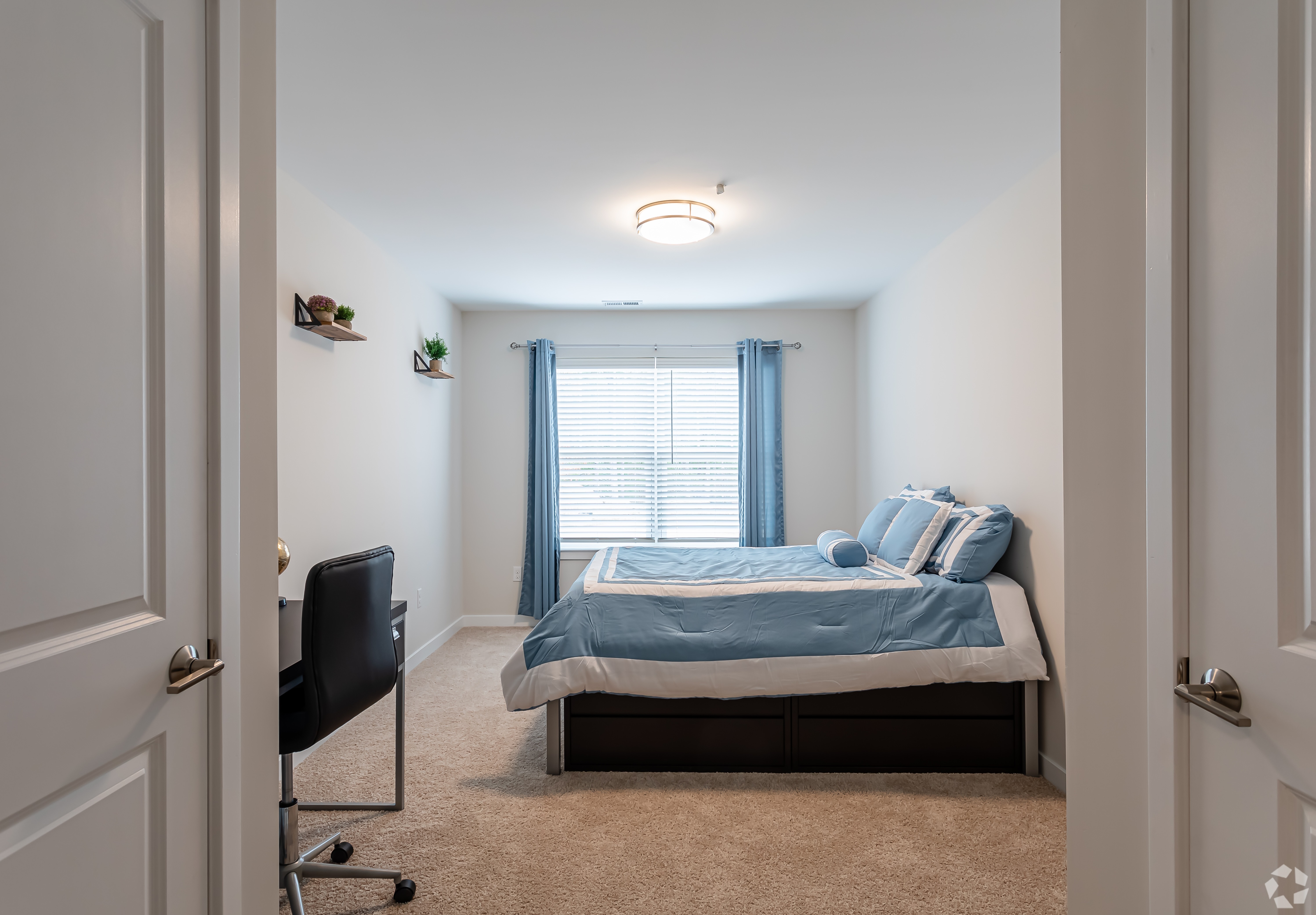 Furnished bedroom with bed and window