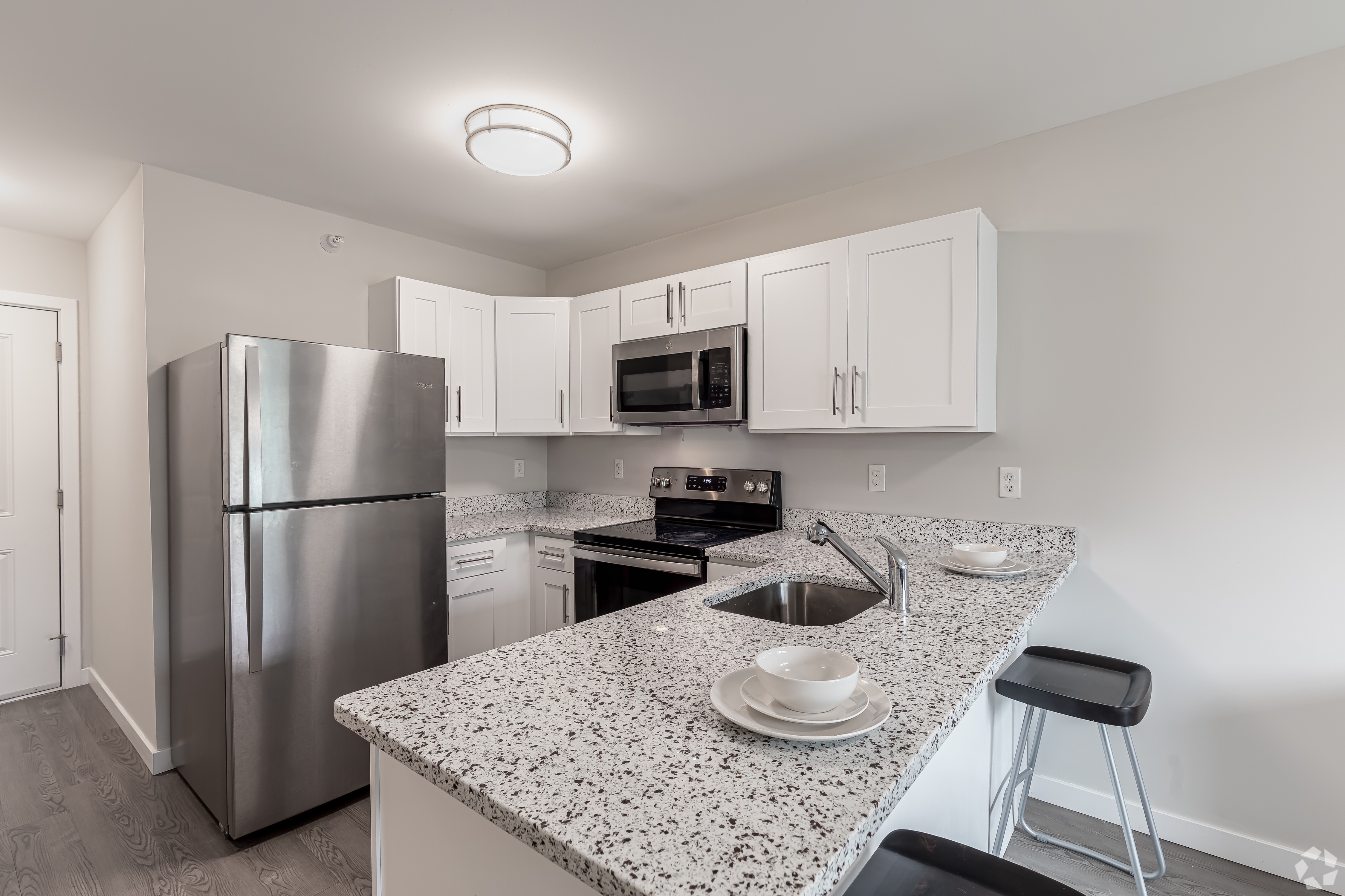 Kitchen with white cabinets and stainless steel appliances