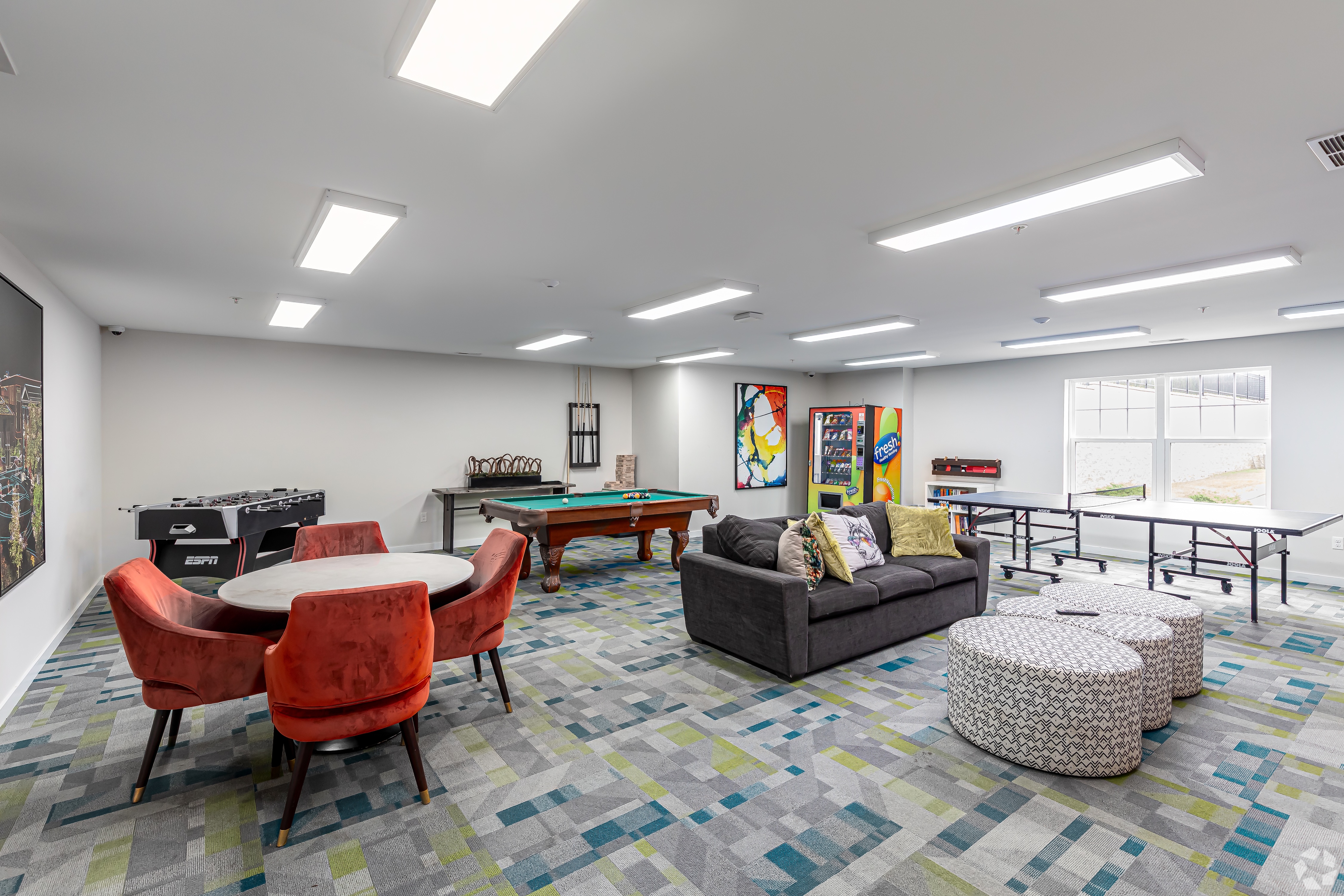 Clubhouse room with lounge seating a pool table