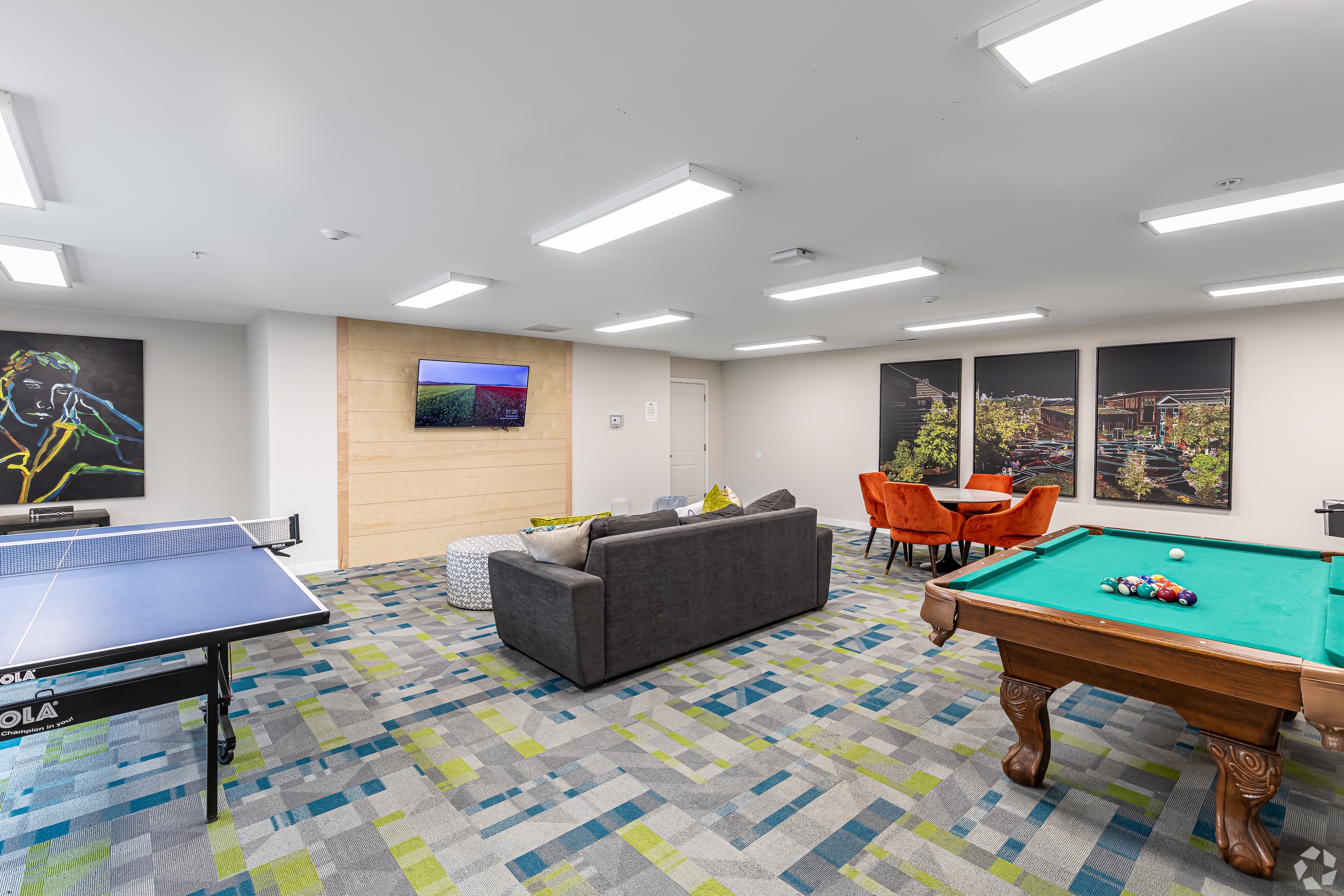 Clubhouse room with pool table and lounge seating