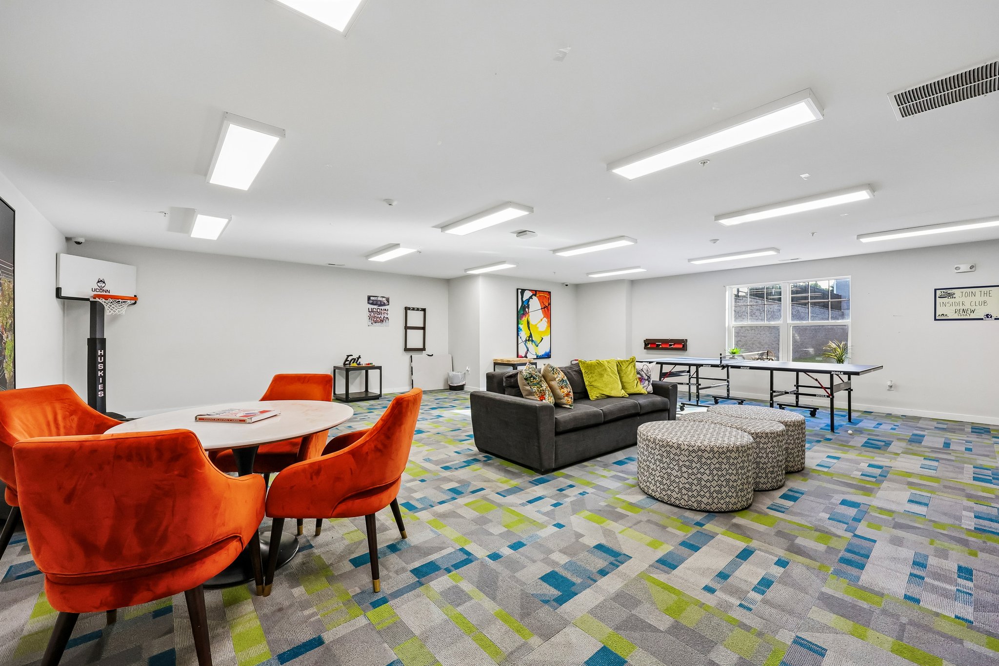Resident clubhouse with lounge seating and games