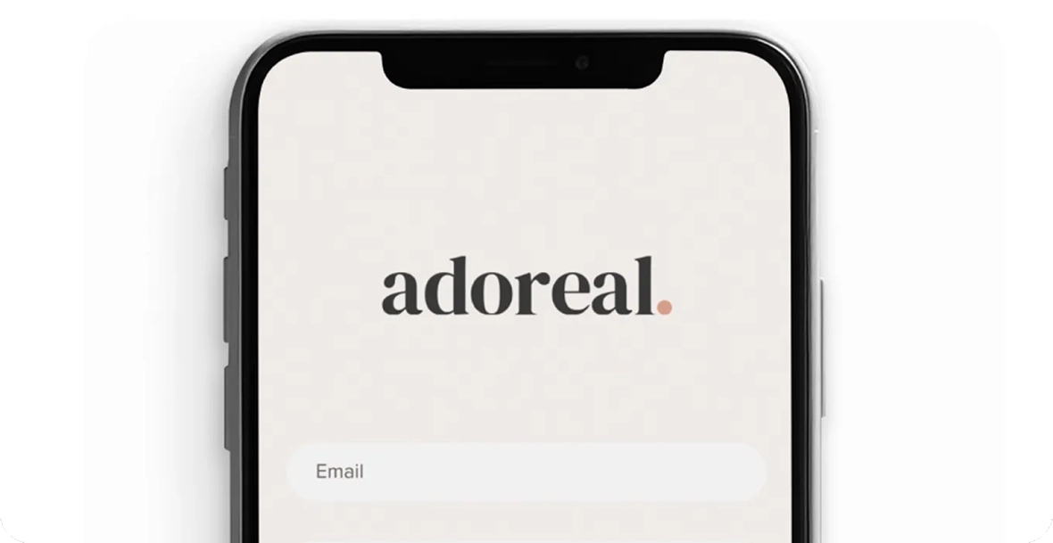 Smartphone displaying the Adoreal app login screen
