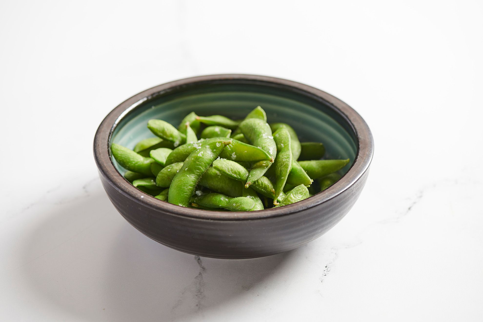 Edamame with yuzu ponzu brings a light, citrusy accent to early spring meals in Arlington Heights, IL, just one way to explore what's fresh.