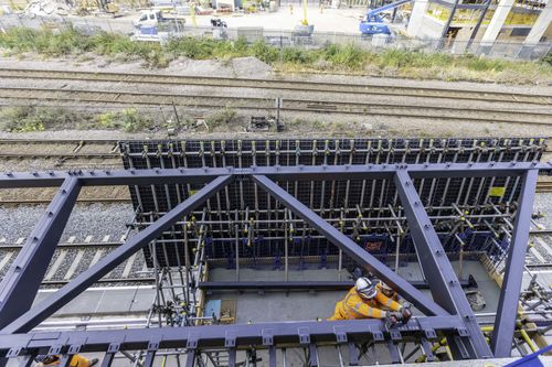 Operatives at work on scaffold while protected by GRP membrane.
