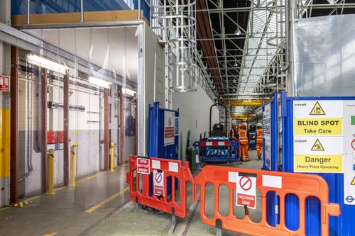 Entrance to acoustic tunnel within construction work in operation.