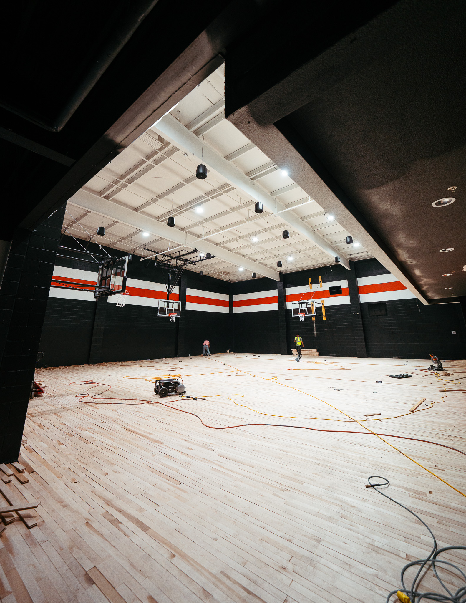 Hardwood basketball court installation at Forge Performance Lab by Modern Ozarks NWA