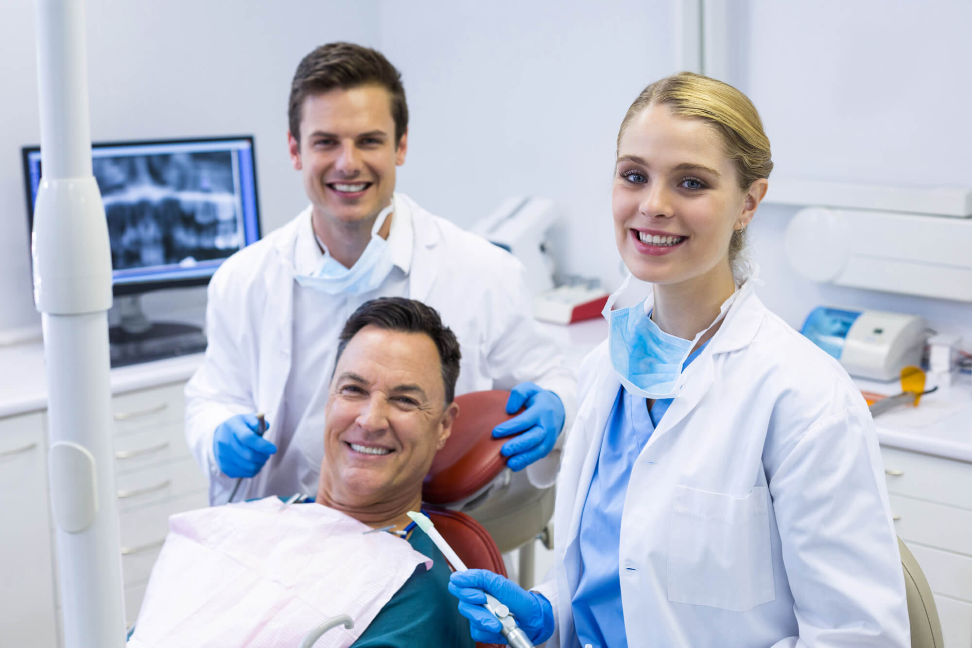 dentists and male patient for Teeth in a day in coral springs