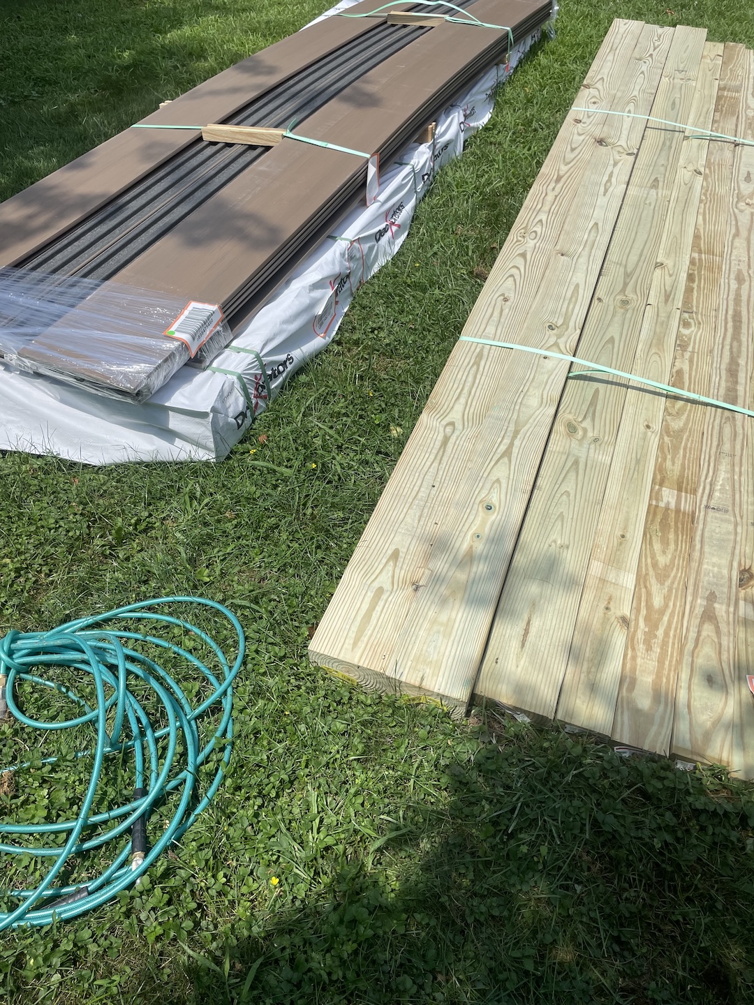 Decking materials staged on-site for a new installation project.