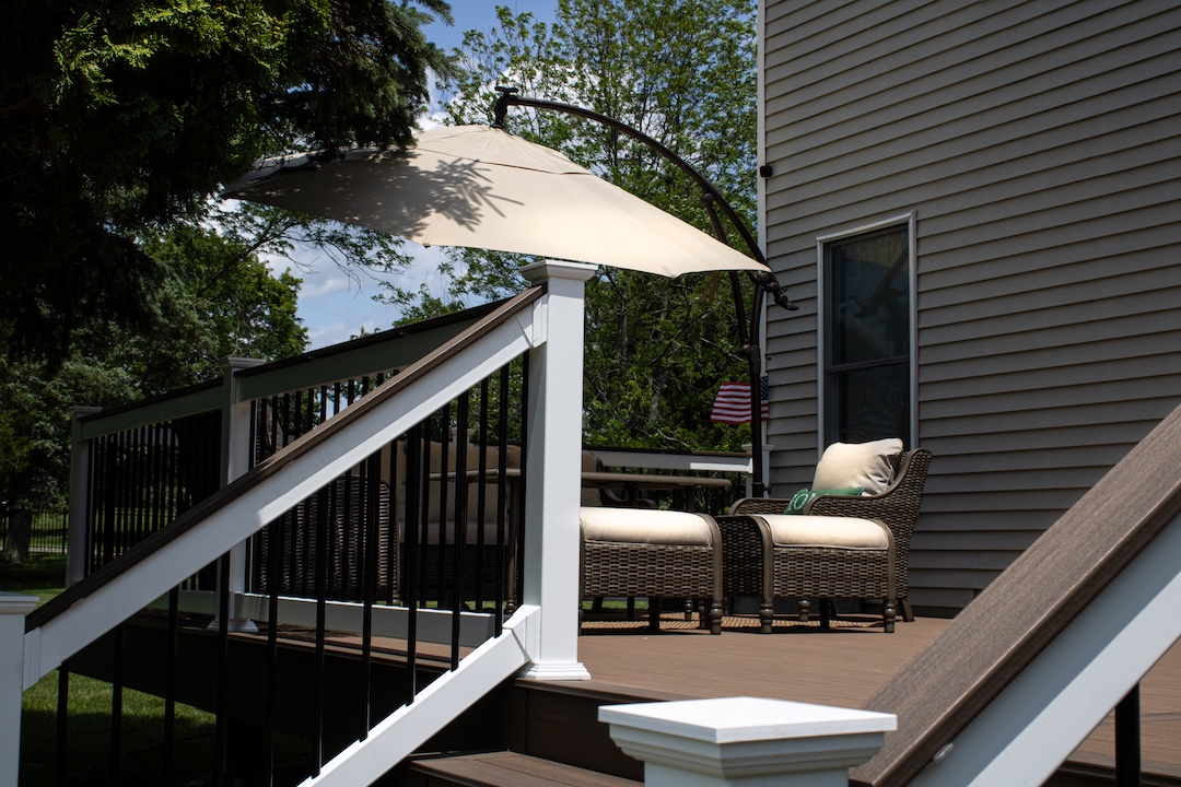 Deck with white-and-black railings attached