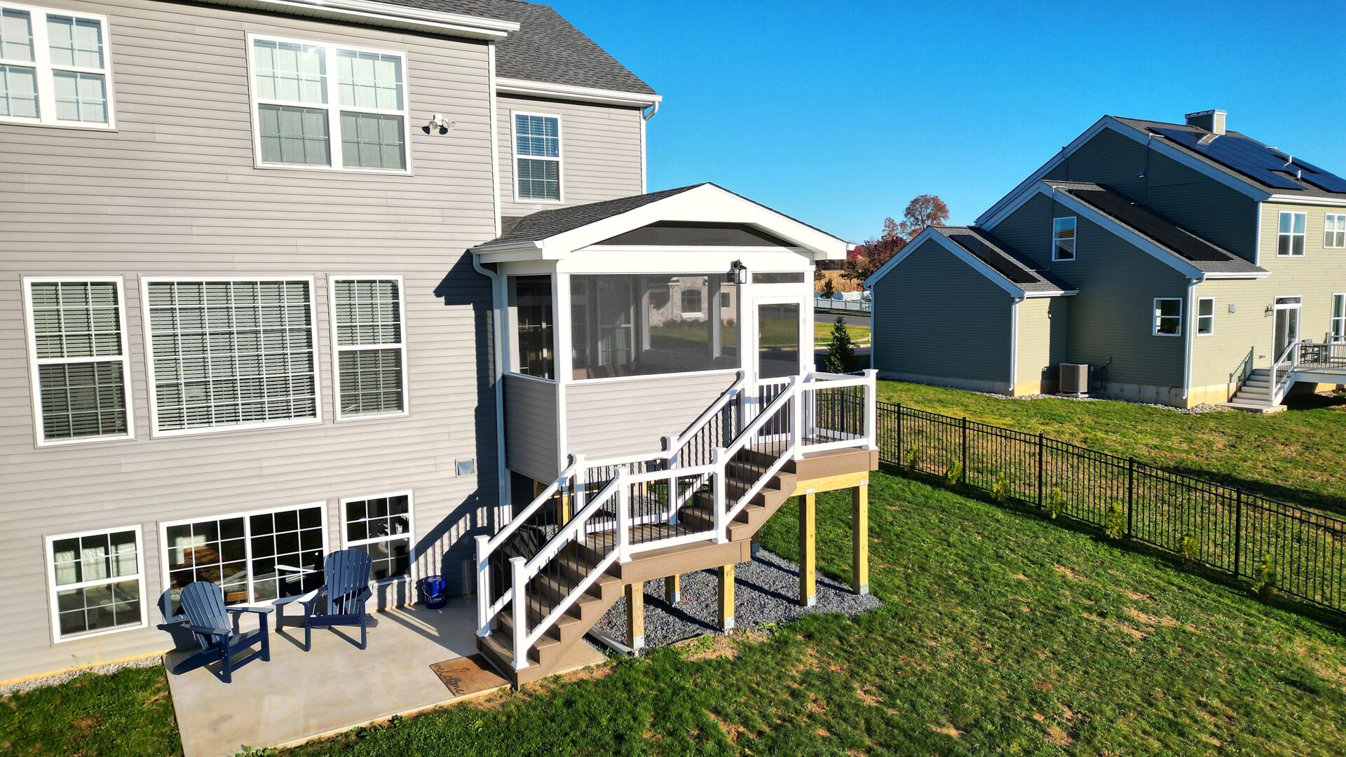 New elevated deck and screened porch with Deckorators Venture Sandbar decking in Easton, PA.
