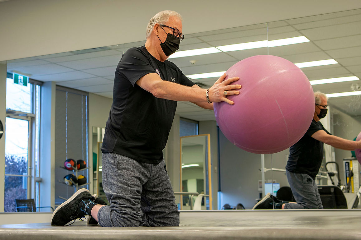 Synaptic Client Working with an Exercise Ball - two point position