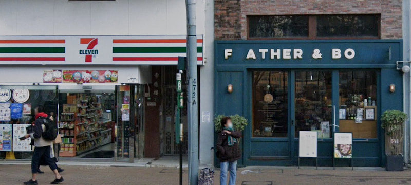 Next to a 7-Eleven, a dark blue shop with a 'F ATHER & BO' sign (missing the letter F) sits near two people walking by; nearby spaces like Ref#3666 are ideal for renting as shops or restaurants.