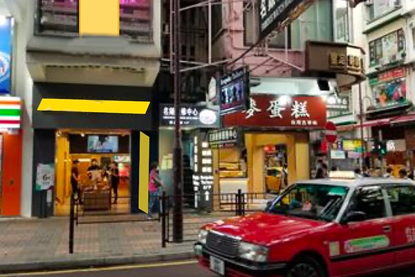 Ref#3173: Urban street scene with shops like 7-Eleven and a bakery, red taxi passing by, and people walking past Chinese storefronts	40perfect for those seeking shop or restaurant rental space.