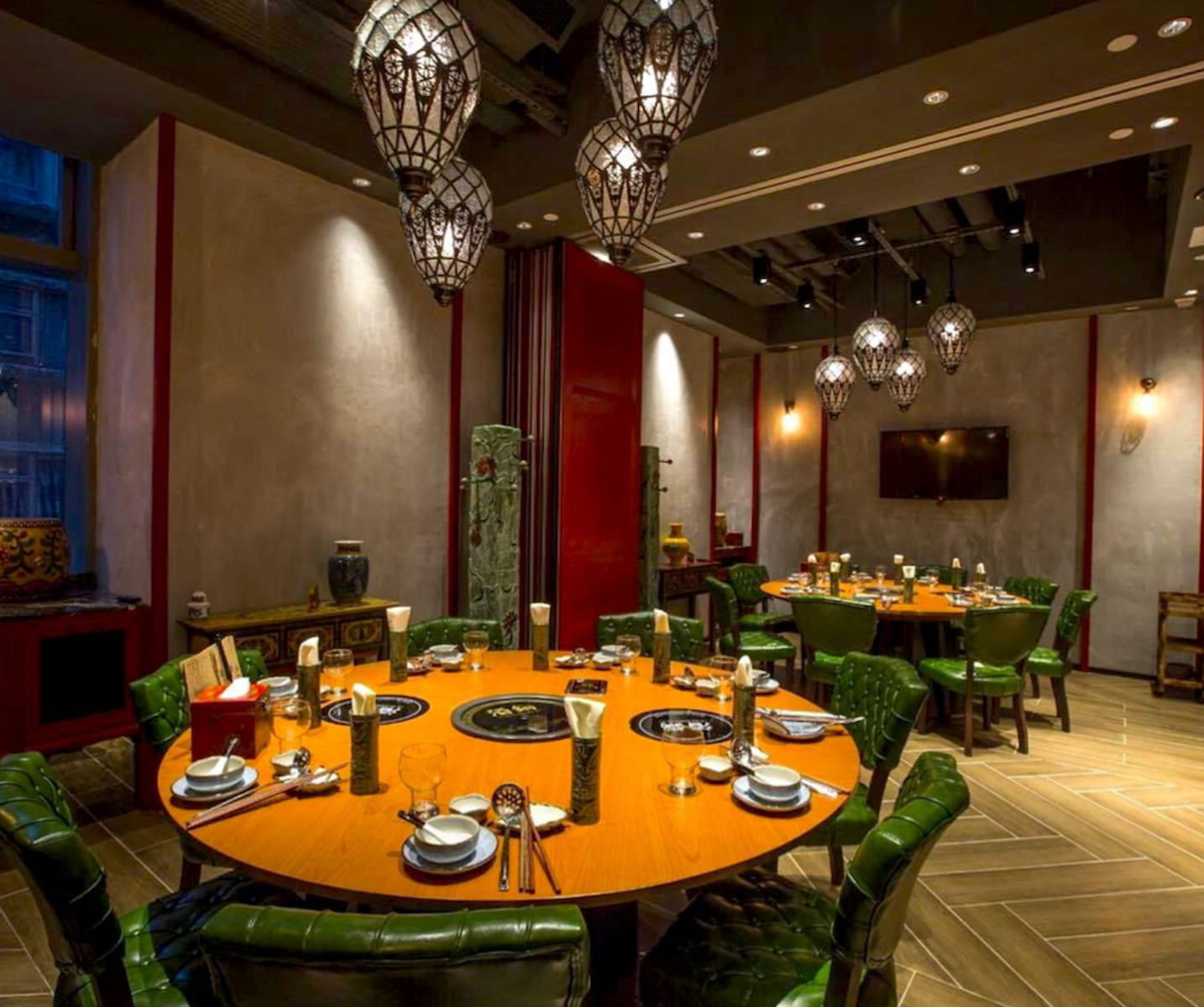 Ref#3441 features a stylish restaurant interior with round wooden tables, green cushioned chairs, and ornate pendant lights9ideal for those looking to rent restaurant space with modern decor.