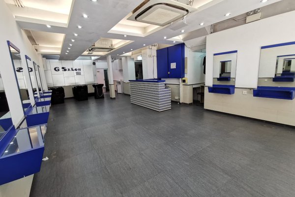 Ref#3431: A modern, empty hair salon featuring blue and white decor, multiple mirrors, styling stations, and black wash basins ideal for shop rental or transforming into a stylish salon or boutique.