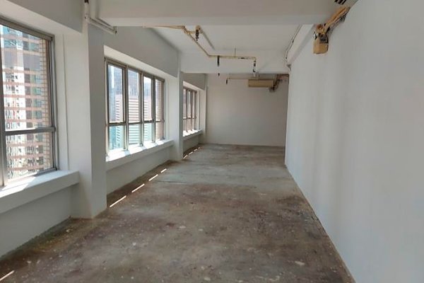 Ref#3510 features an empty room with large windows, bare concrete floors, and white walls. Sunlight fills the space, making it a bright option for shop or restaurant rental.