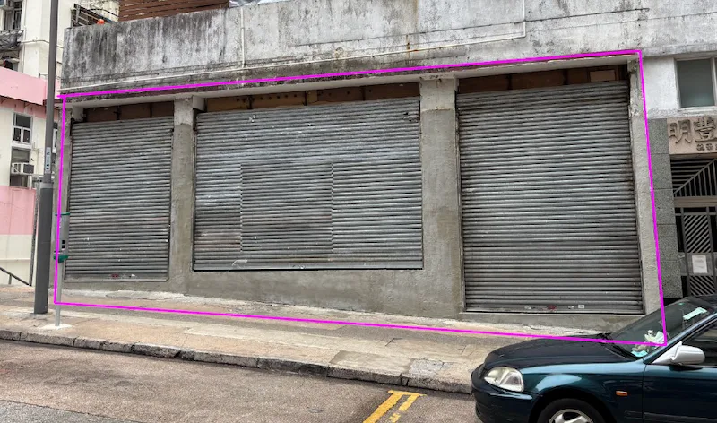 Shop on Yuk Wah Crescent, Wong Tai Sin. Three metal roller shutters close off storefronts with a parked car nearby.