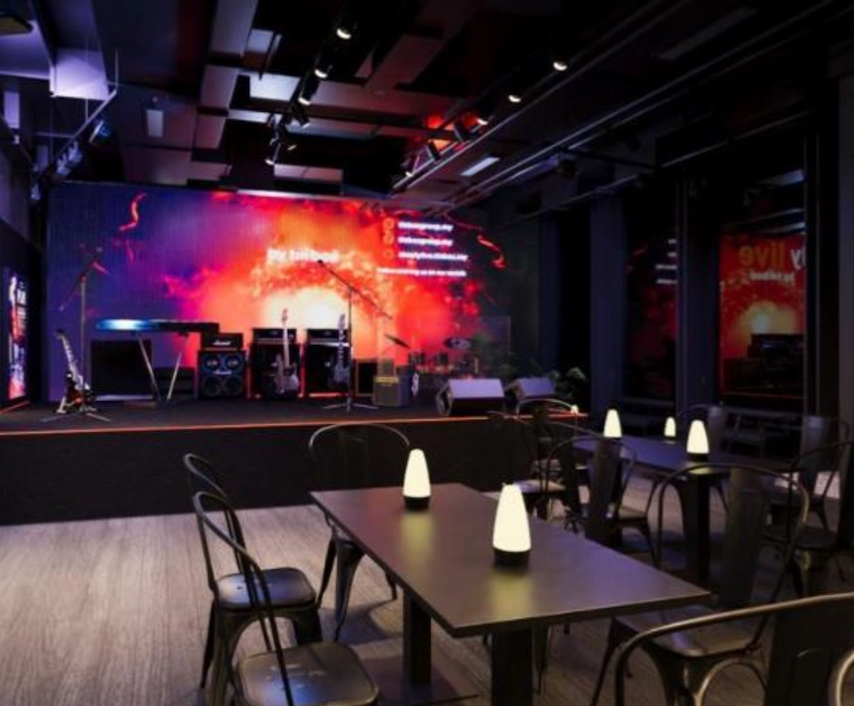 A small stage with musical instruments in a dimly lit Central venue prepared for a D’Aguilar Street live event.
