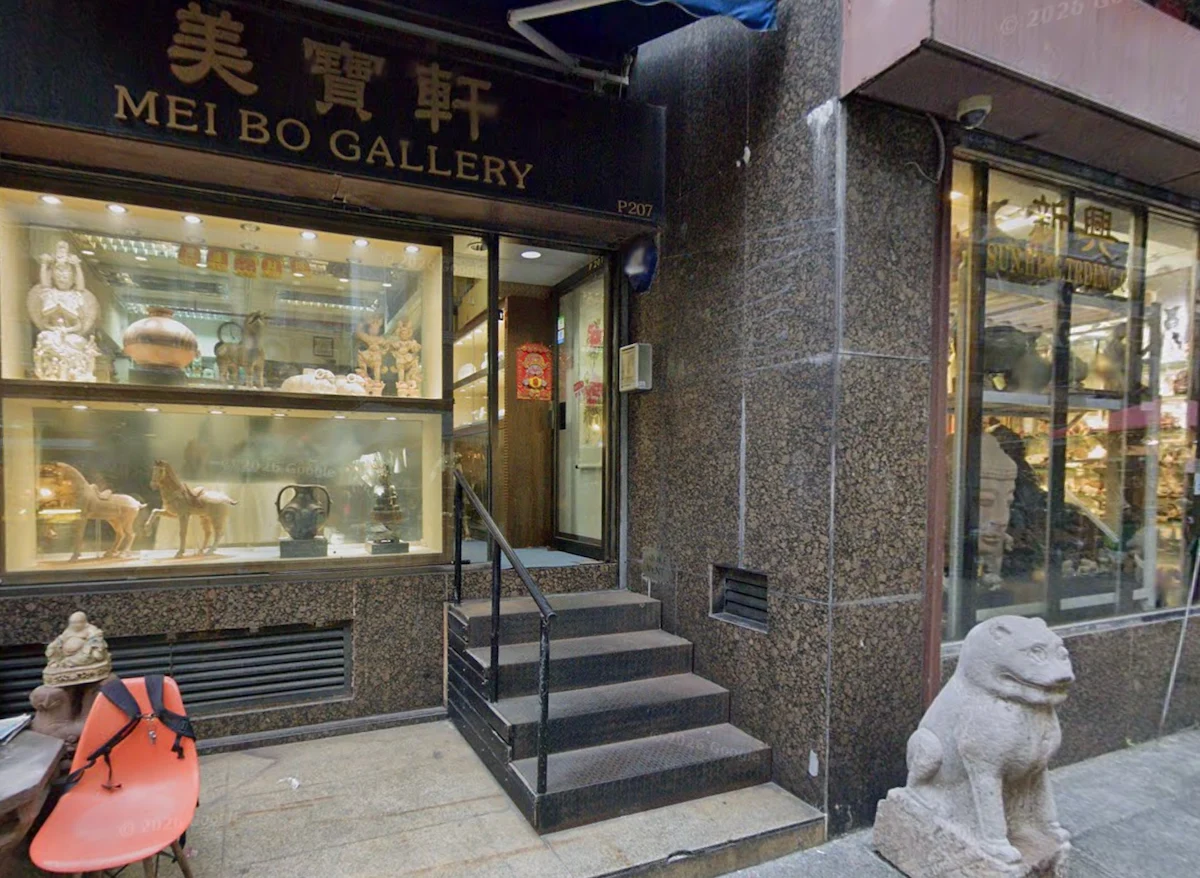 Entrance to Mei Bo Gallery on Lok Ku Road, Sheung Wan, showing steps, art displays and a stone lion statue on the right.
