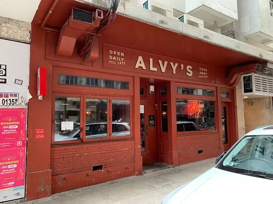 Restaurant space on Holland Street, Kennedy Town. Red brick restaurant with ALVYS sign, windows, door, and parked cars visible.