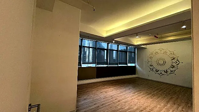 Office at One Mong Kok Road Commercial Centre, Mong Kok: open area with wood flooring and feature wall
