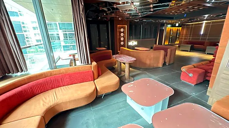 Fitted restaurant at H Code, Central – lounge seating beside the windows to the verandah