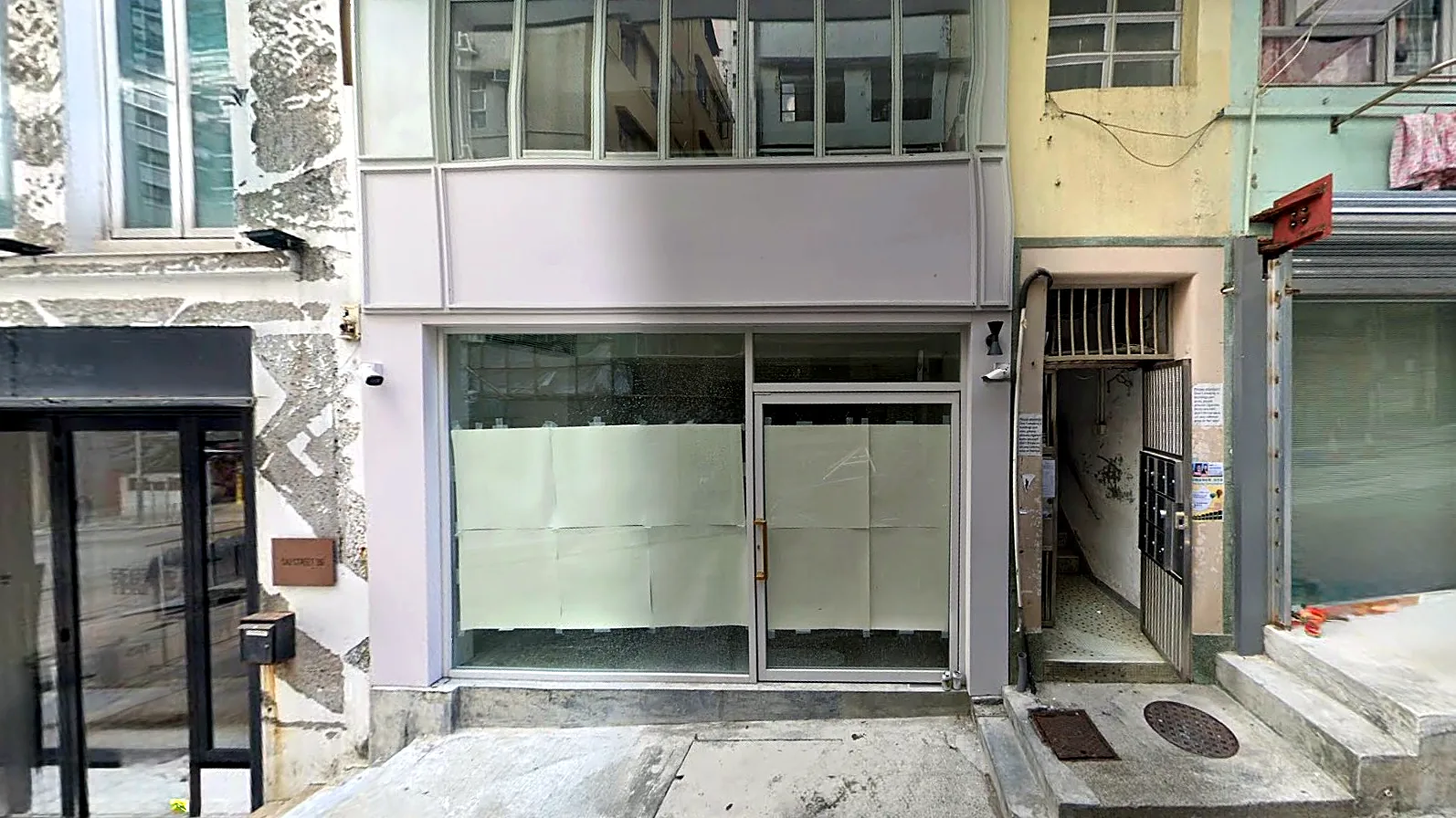 Street shop on Sai Street, Sheung Wan: glazed ground-floor shopfront with cockloft windows above