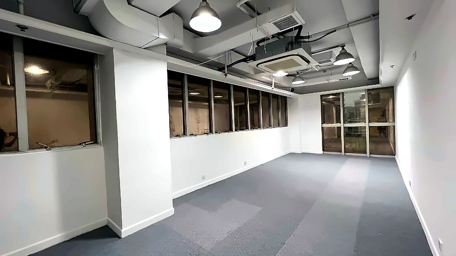 Office at Charmhill Centre, Tsim Sha Tsui – open-plan room with exposed ceiling and carpet tiles