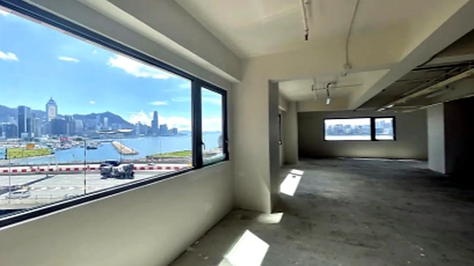 Office at Victoria Centre, North Point – open floor with harbour and Central skyline views