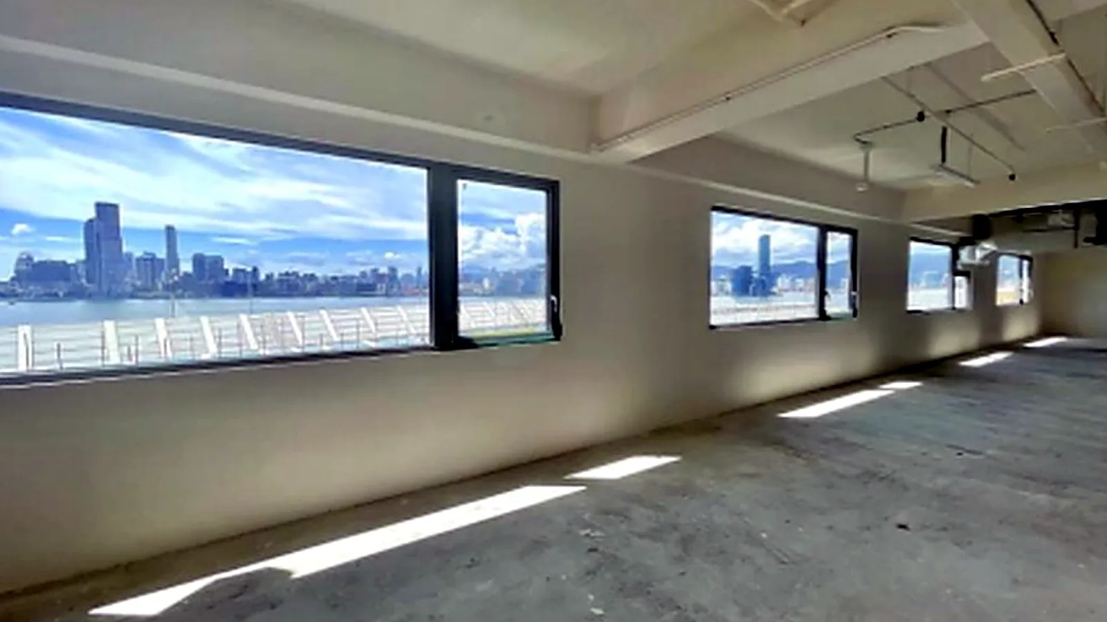 Office at Victoria Centre, North Point – window wall facing the harbour and Kowloon