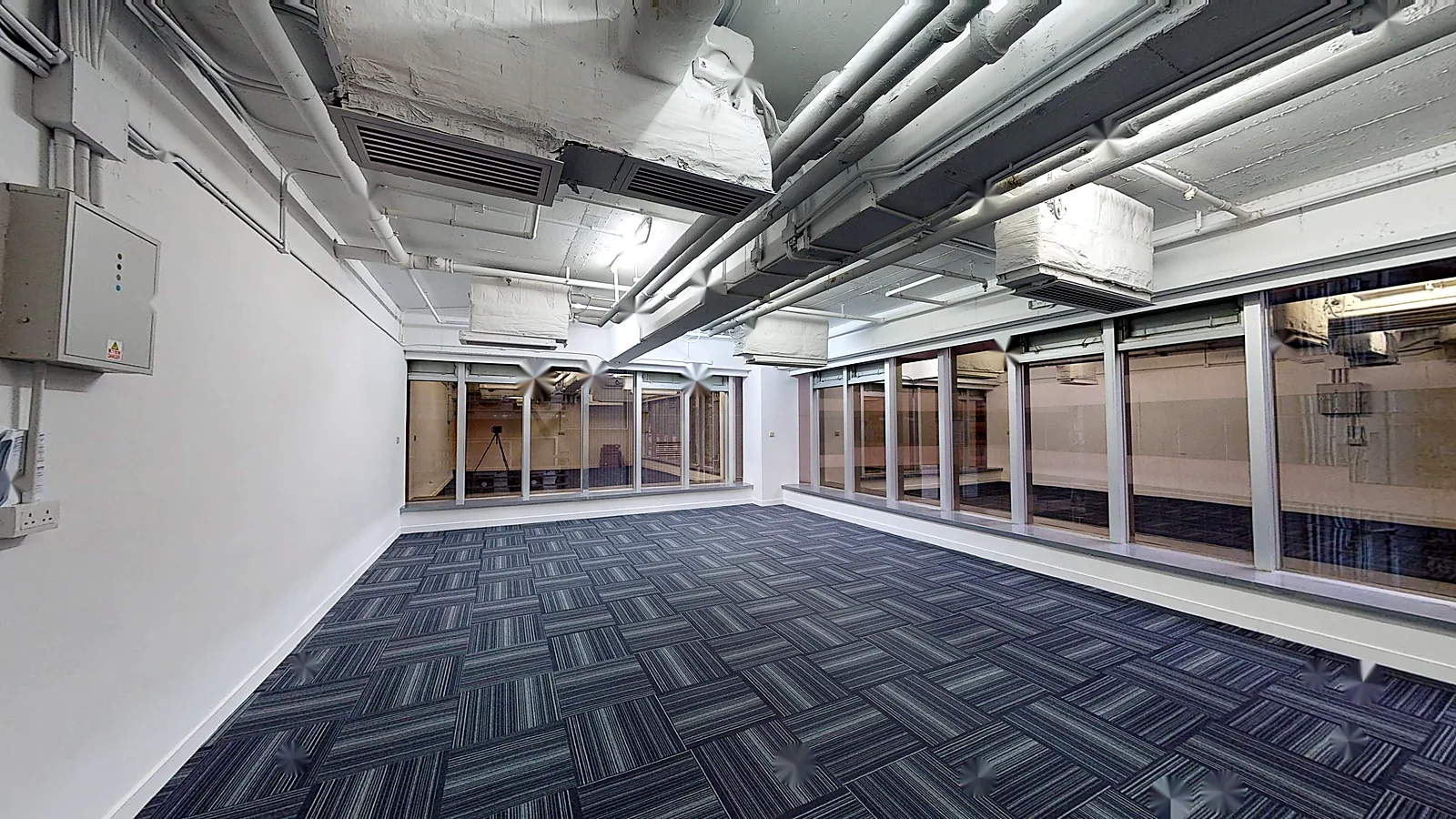 Office at On Hing Building, Central – open-plan floor with carpet and full-height windows