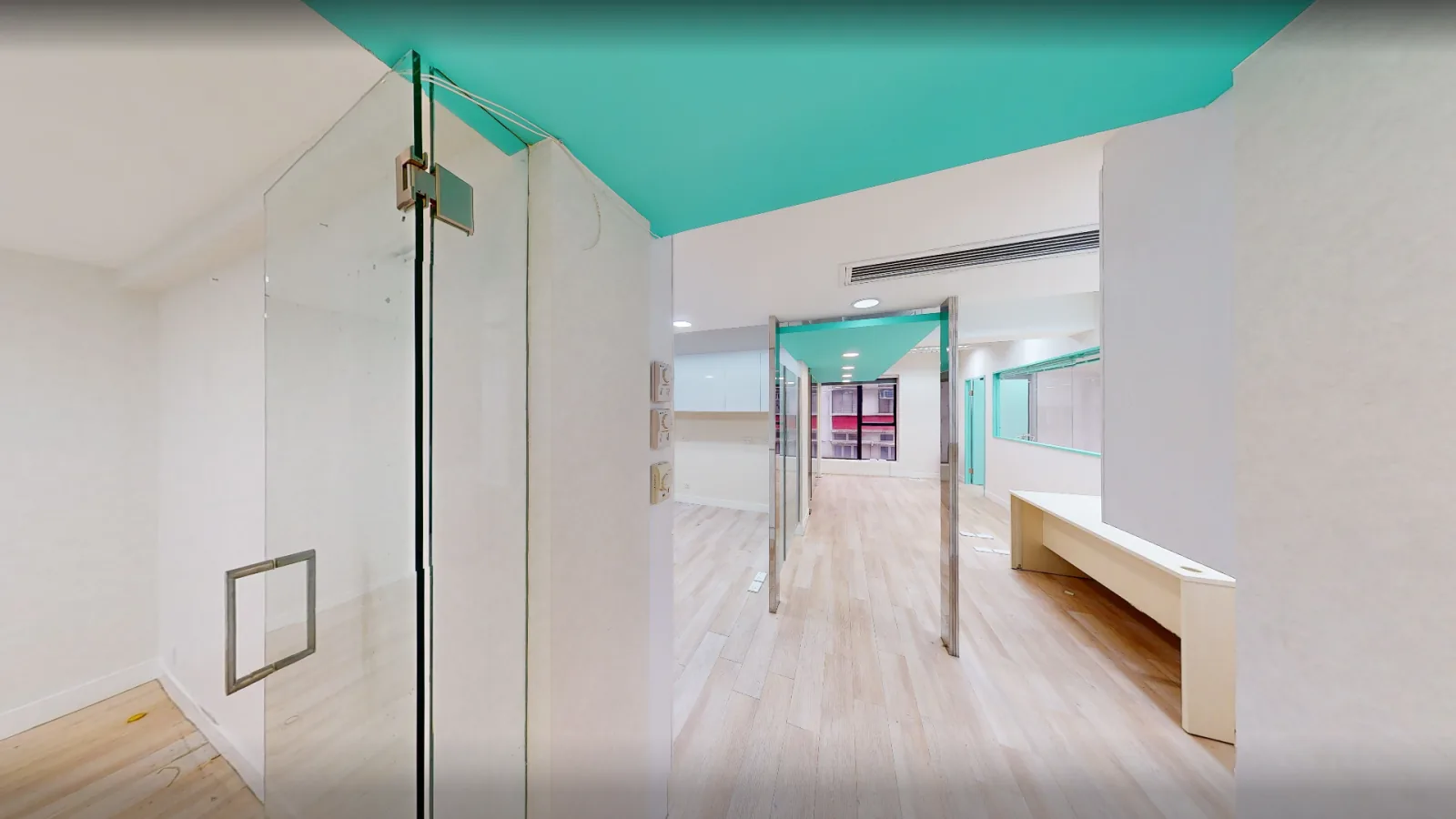 Office at World Trust Tower, Central – glass-partitioned room with built-in counter
