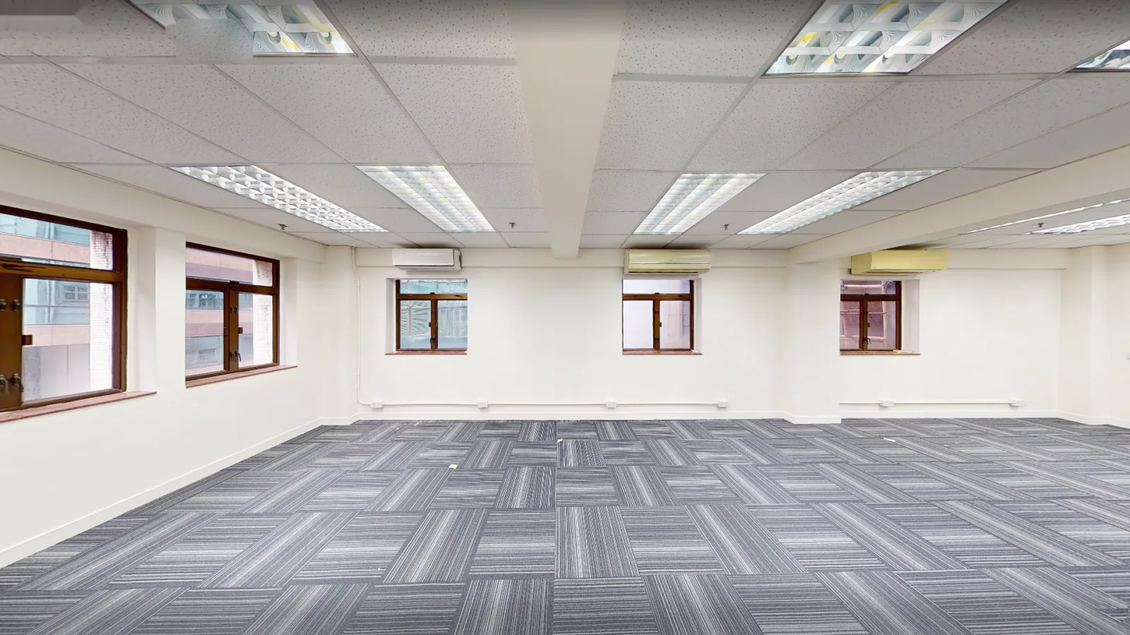 Office at Hong Kong House, Central – open carpeted floor with windows