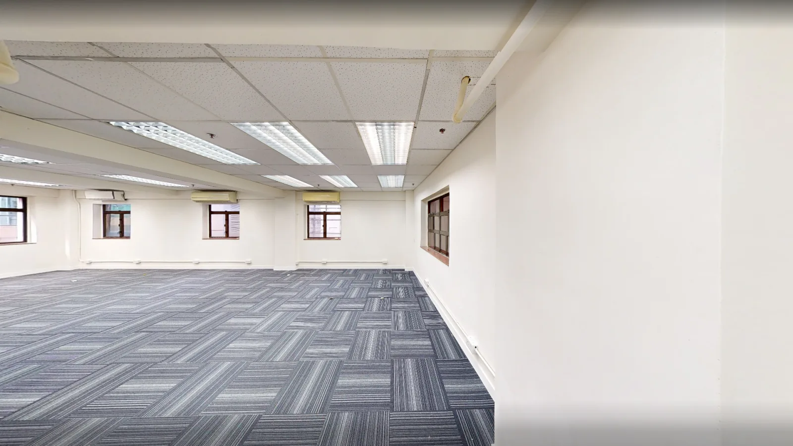Office at Hong Kong House, Central – open floor with ceiling lighting