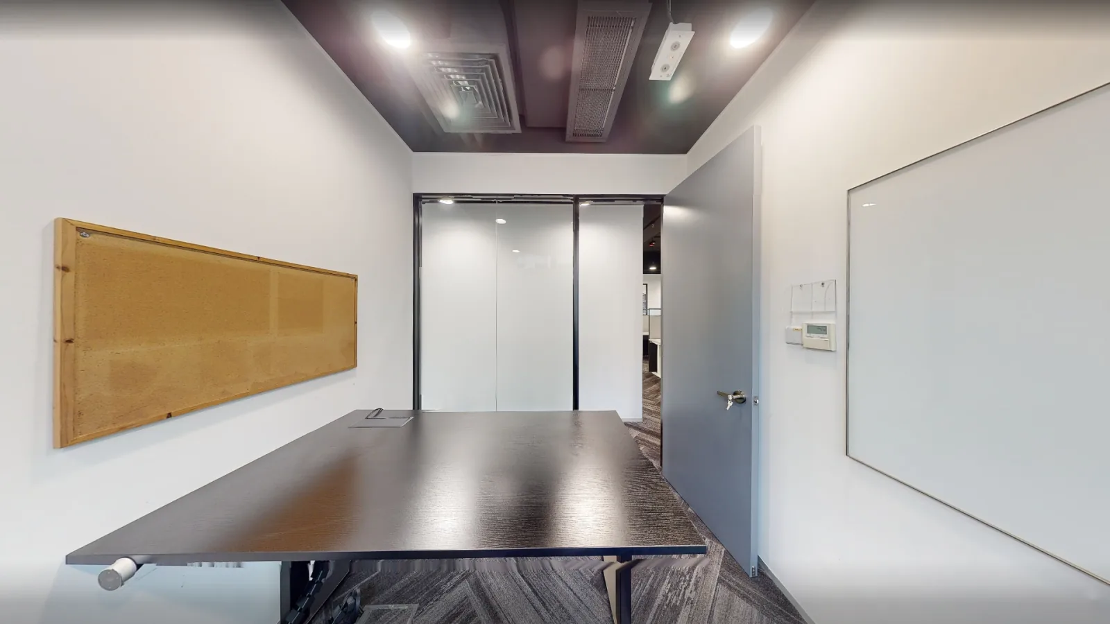 Office at Gravity, Kwun Tong – meeting room with conference table and pin board