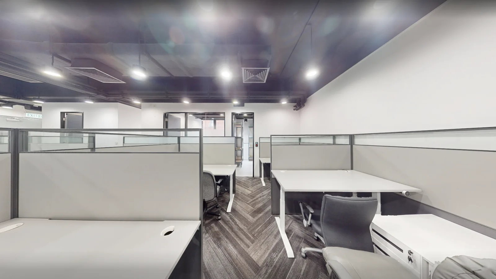Office at Gravity, Kwun Tong – open-plan workstations under a black open ceiling