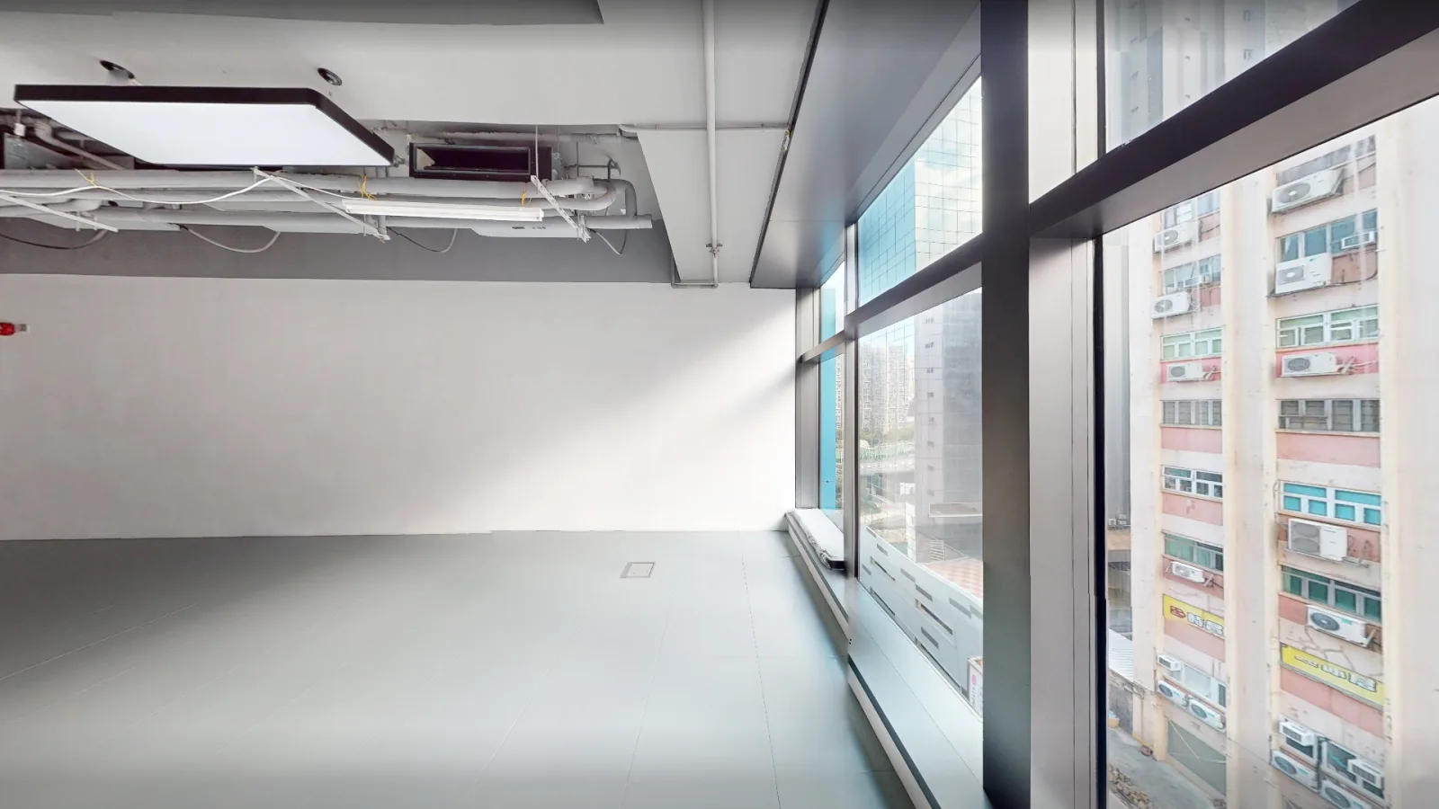 Office at Gravity, Kwun Tong – full-height windows with city views