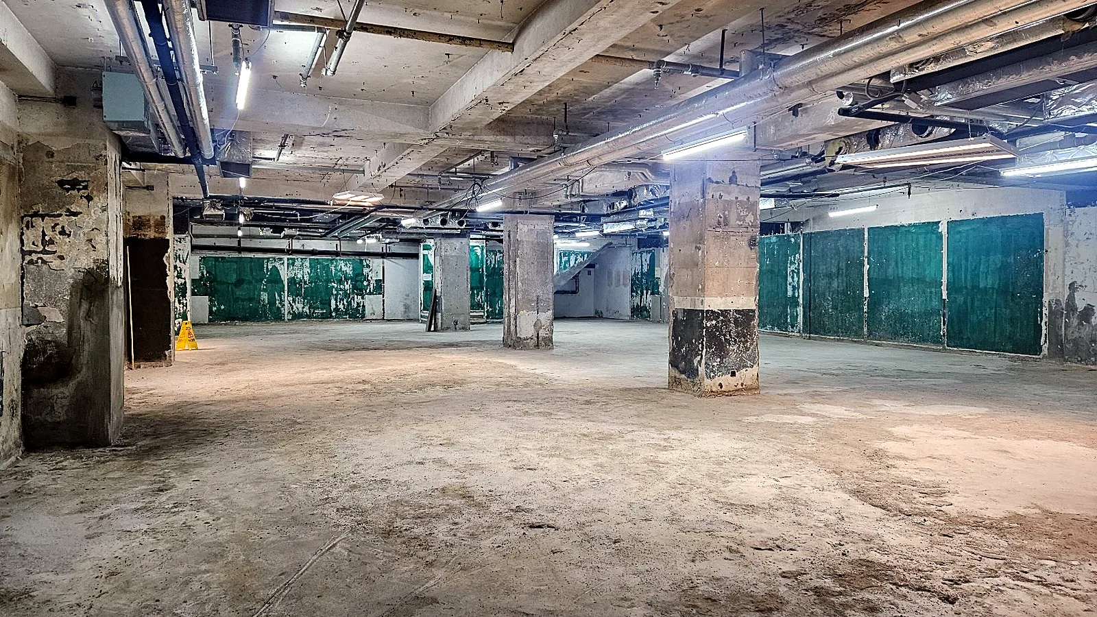 Basement shop for lease at Wilson House, Central - open shell with columns