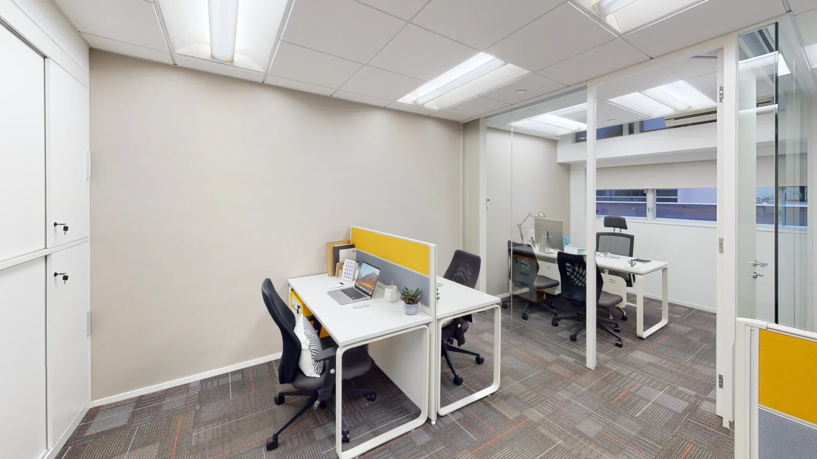 Office for lease on Wing Lok Street, Sheung Wan - desk area toward windows
